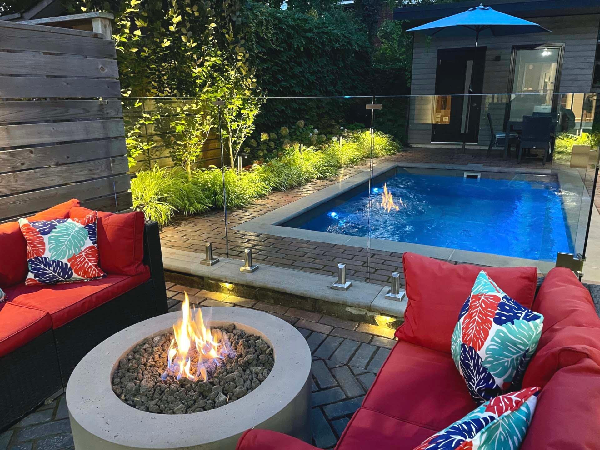 Luxury backyard remodel with custom pool deck, fire bowl, and modern turf elements in Paradise NV