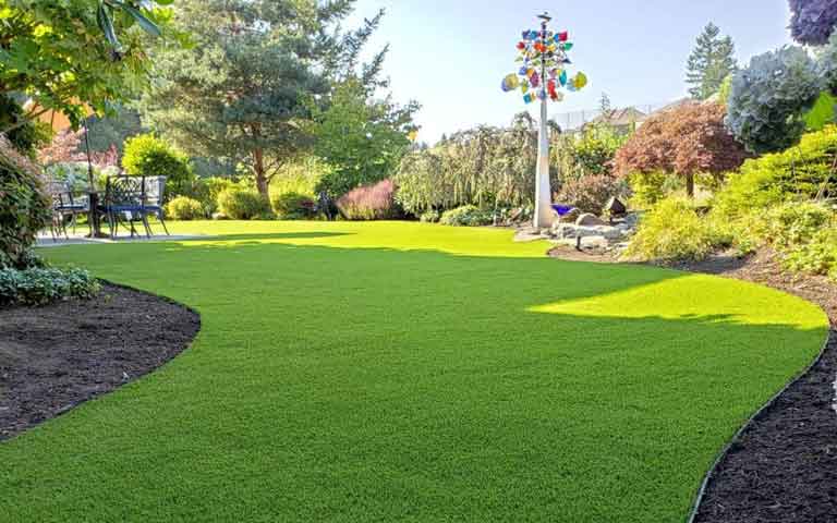 Beautifully manicured artificial grass lawn showing premium curb appeal