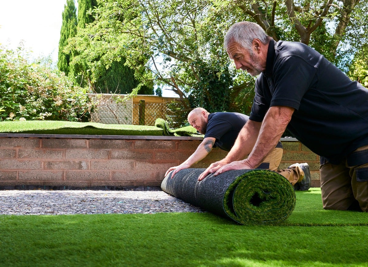 Pet friendly poolside turf in Las Vegas backyard with drainage visible through clear backing